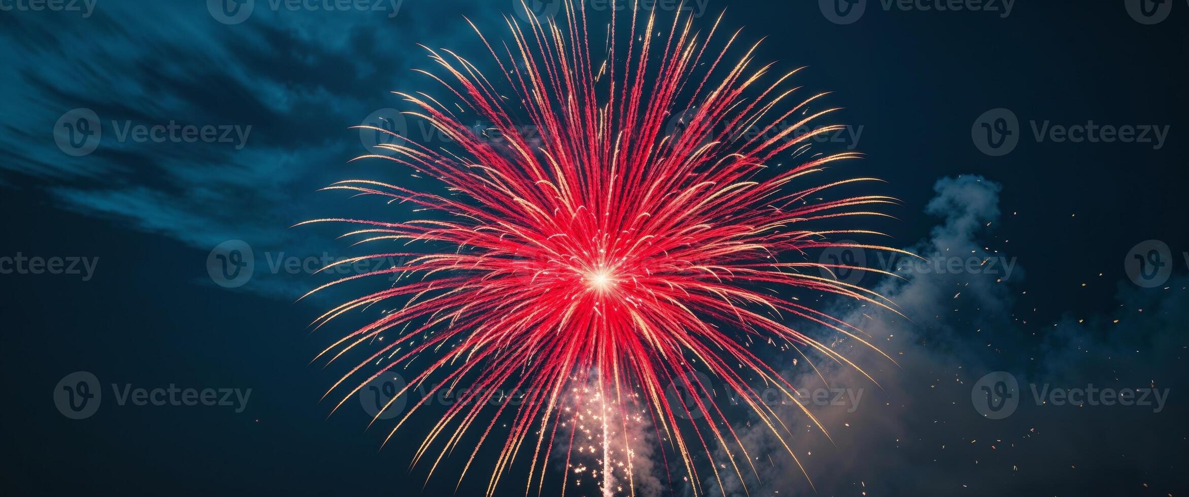 Stunning Red and Gold Fireworks Bursting in Deep Blue Night Sky photo