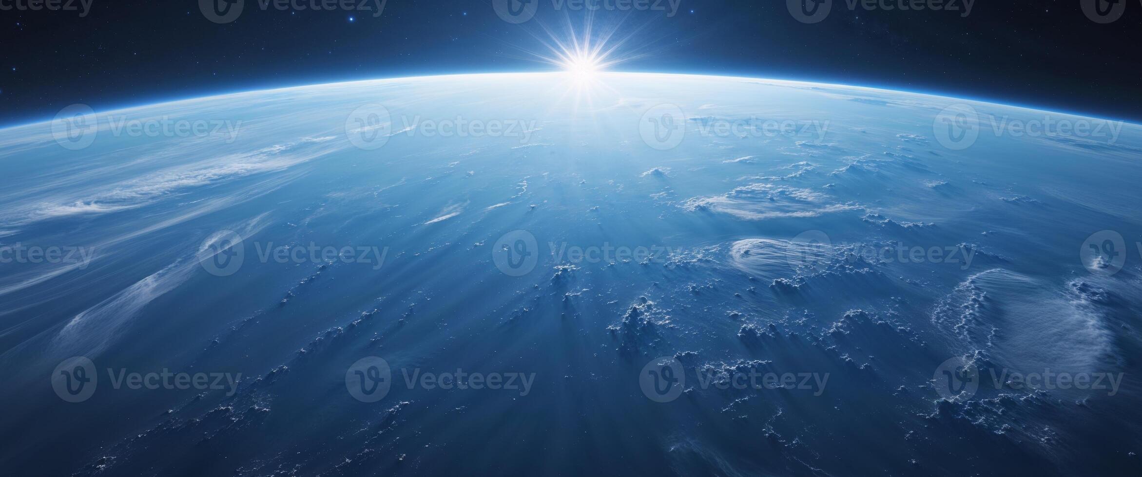 The earth from space with the sun shining photo