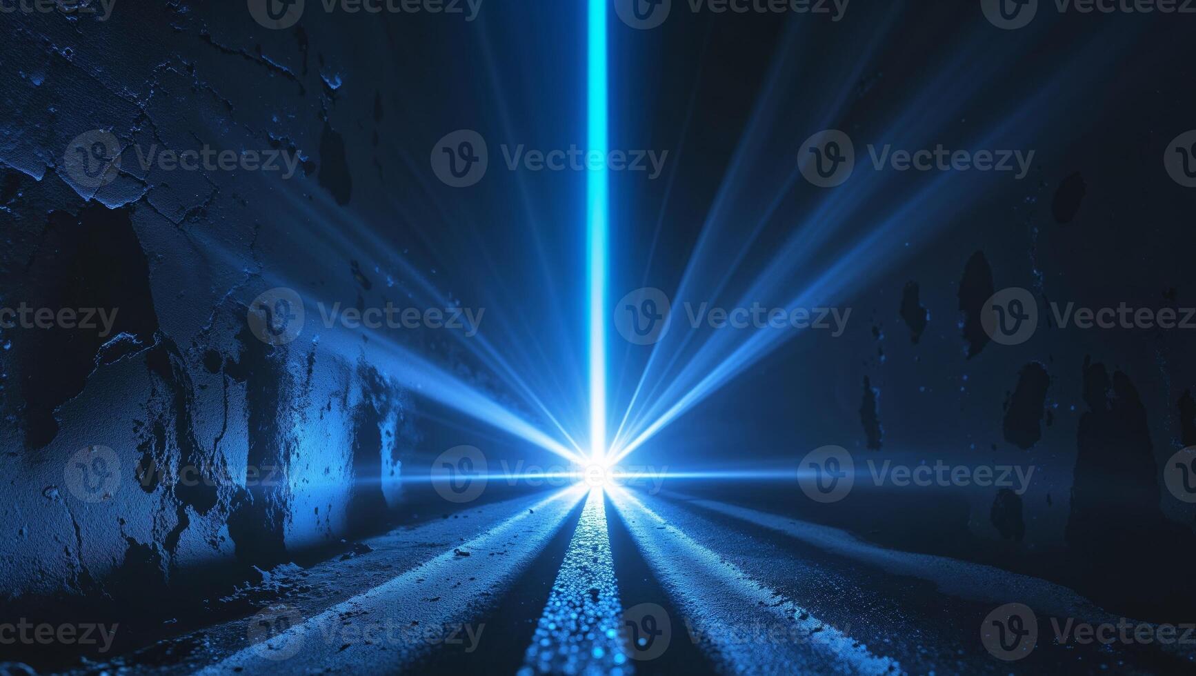 A blue light beam is shining through a tunnel photo