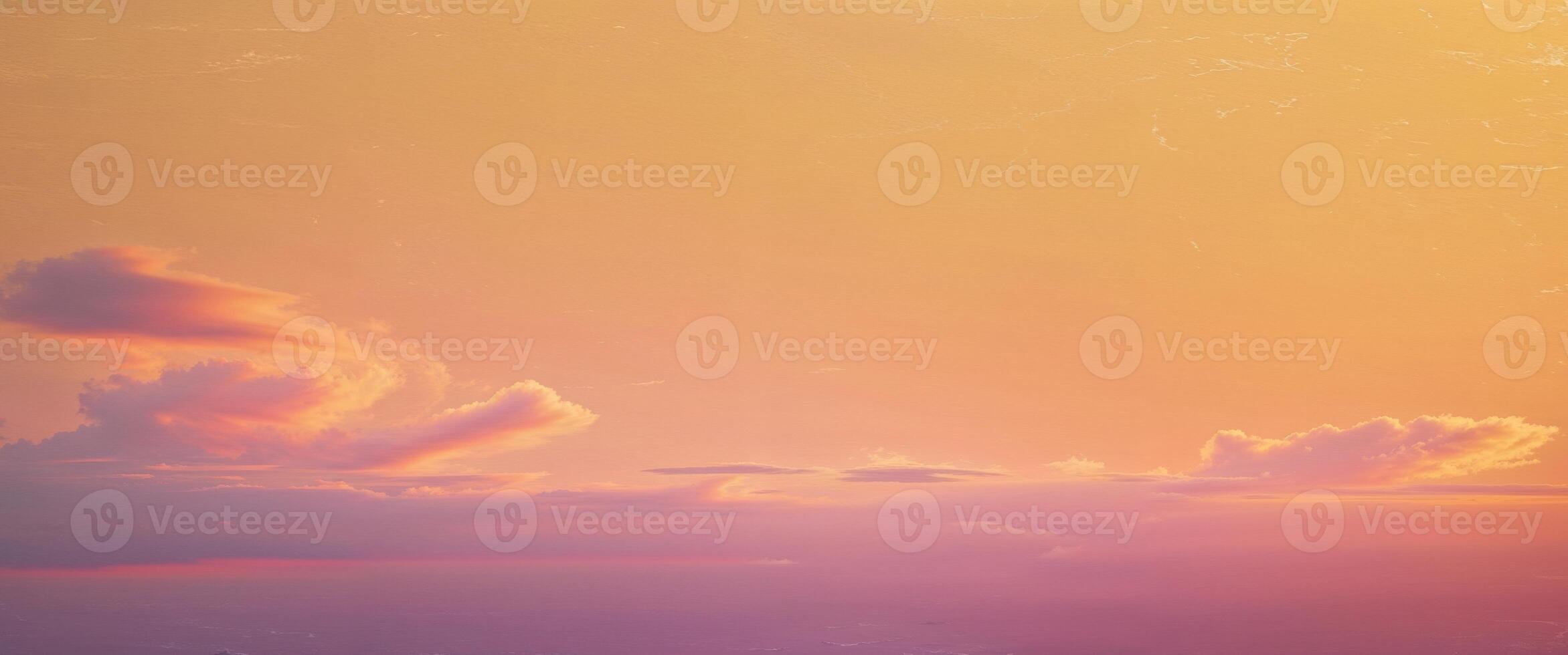 A sunset sky with clouds and a pink and orange color photo