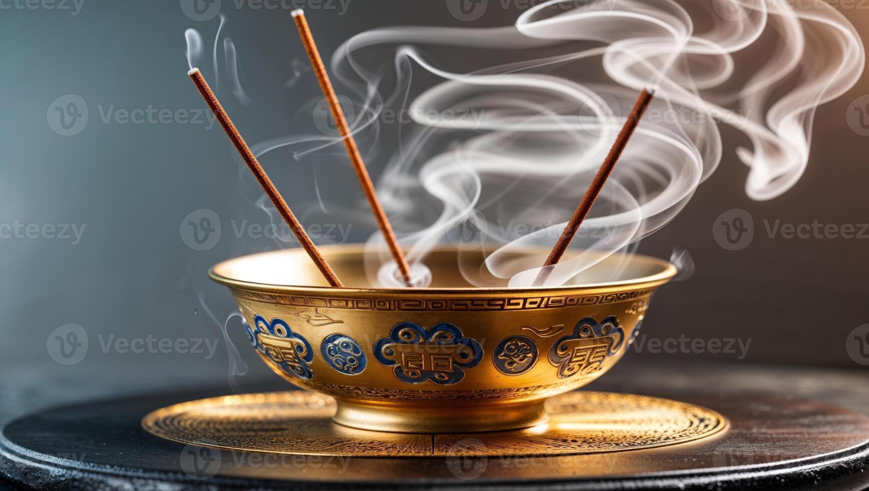 Incense sticks in a bowl with smoke coming out of it photo