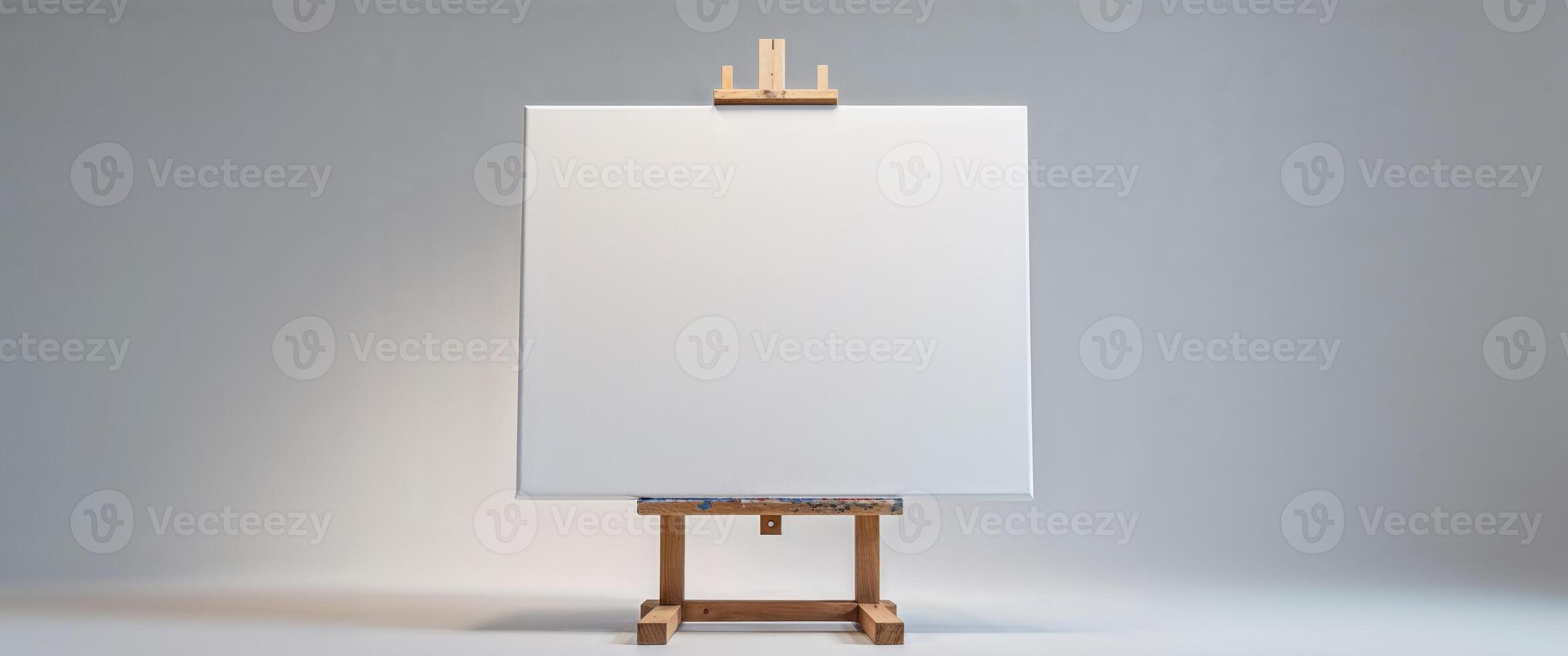 An easel with a blank canvas on it photo