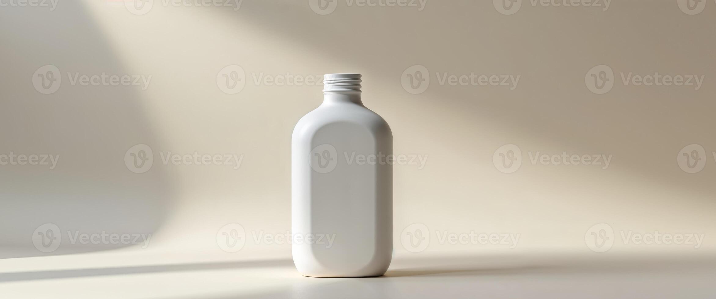 A white bottle is sitting on a table photo