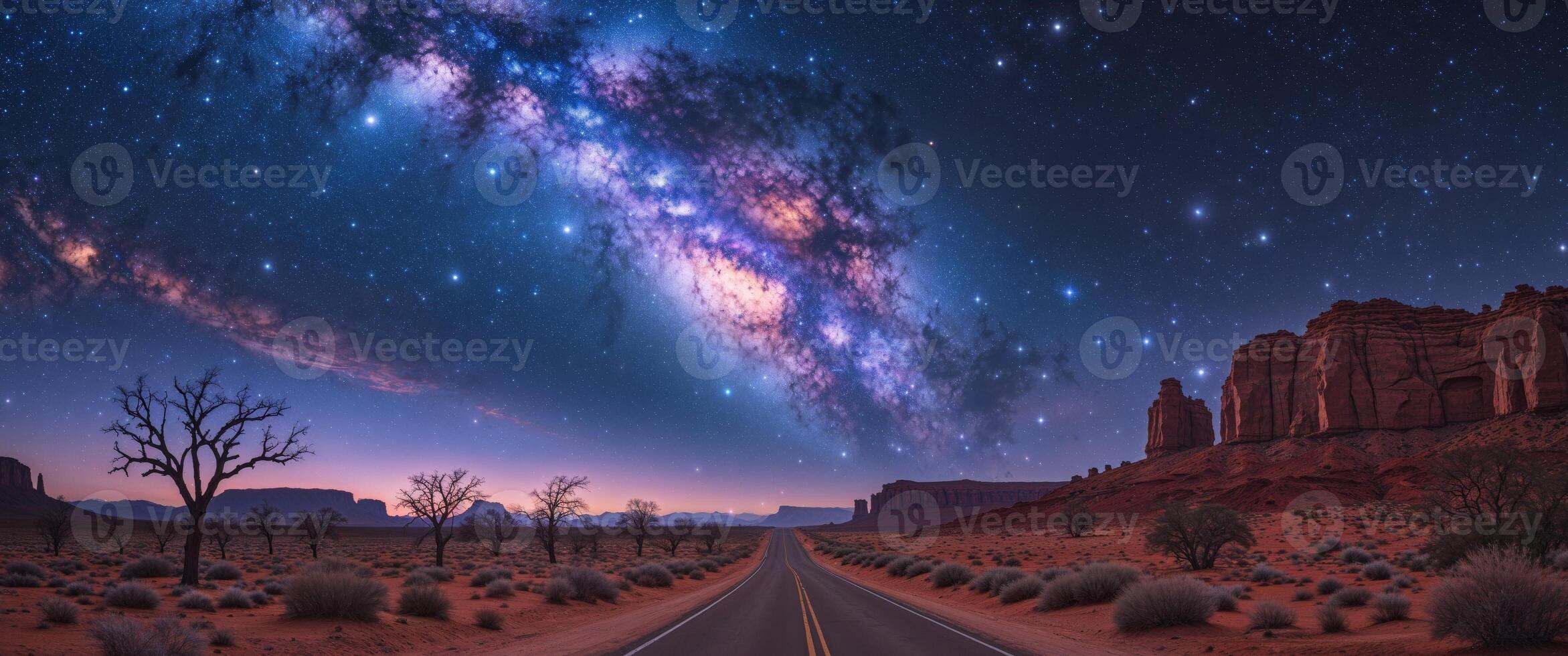 Stunning view of the Milky Way arching over a desert road during a clear night. photo