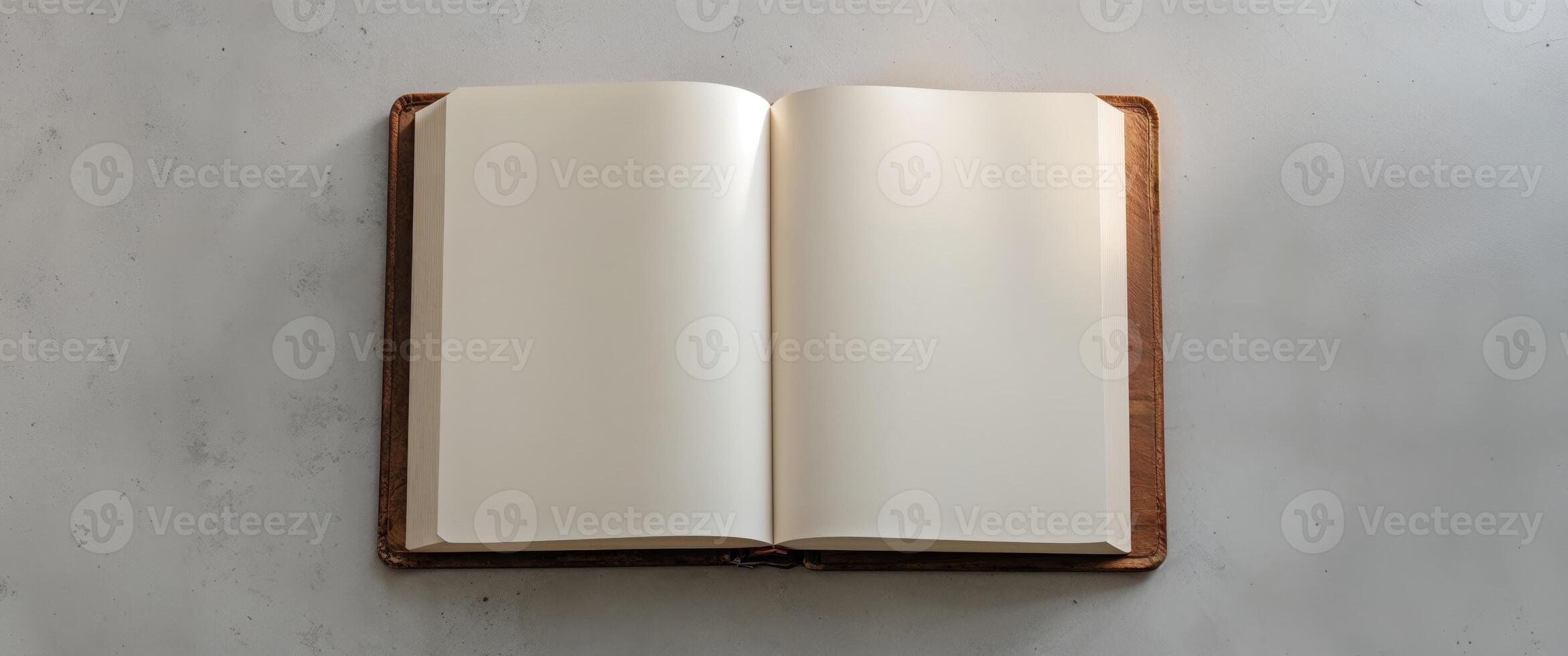 Open Book with Blank Pages Lying Flat on a Neutral Surface photo
