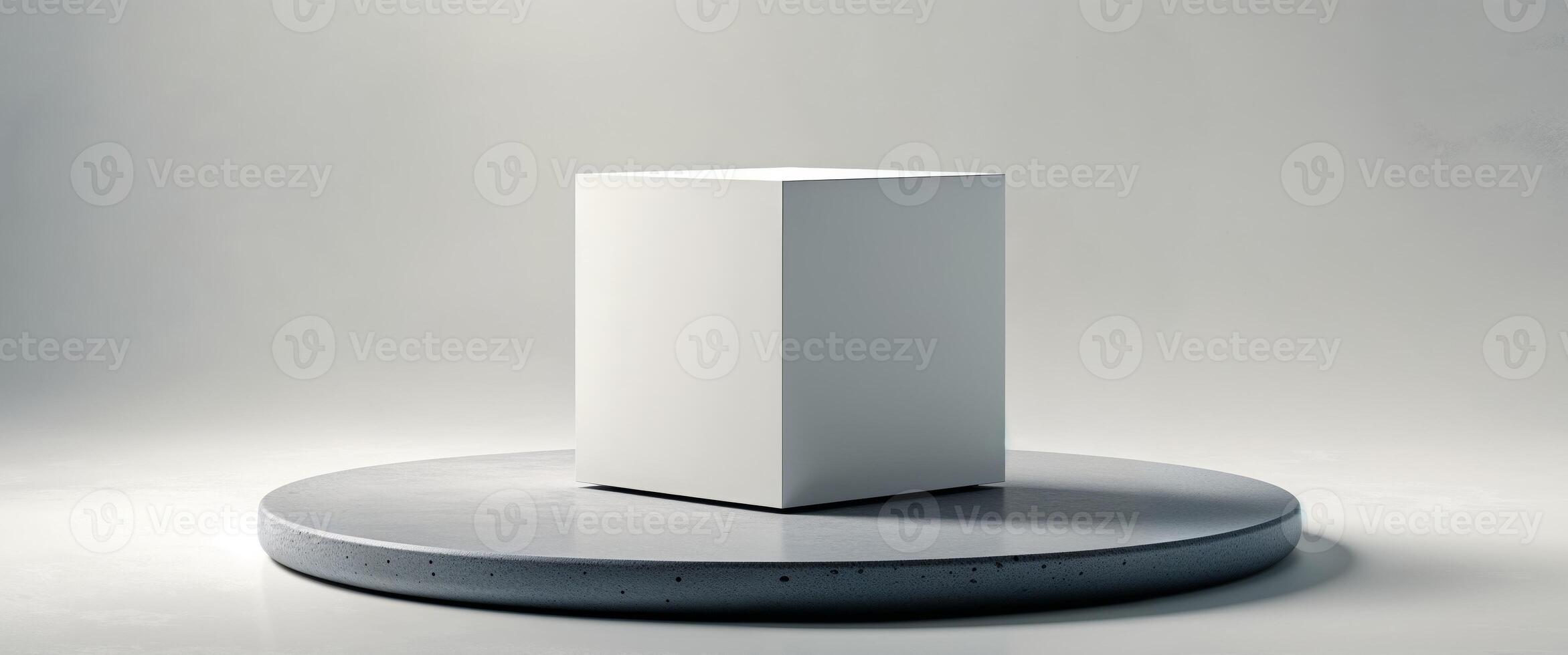 Simple cube resting on a circular stone platform. photo