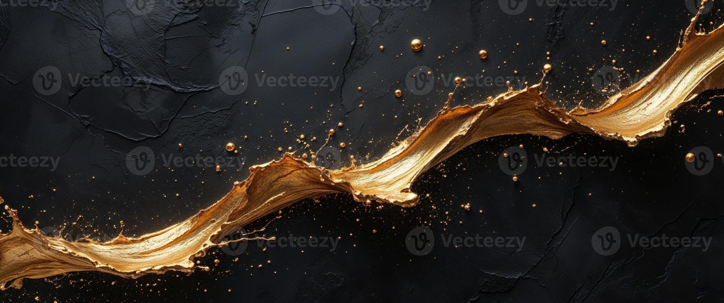 Golden liquid splashing on a black background photo