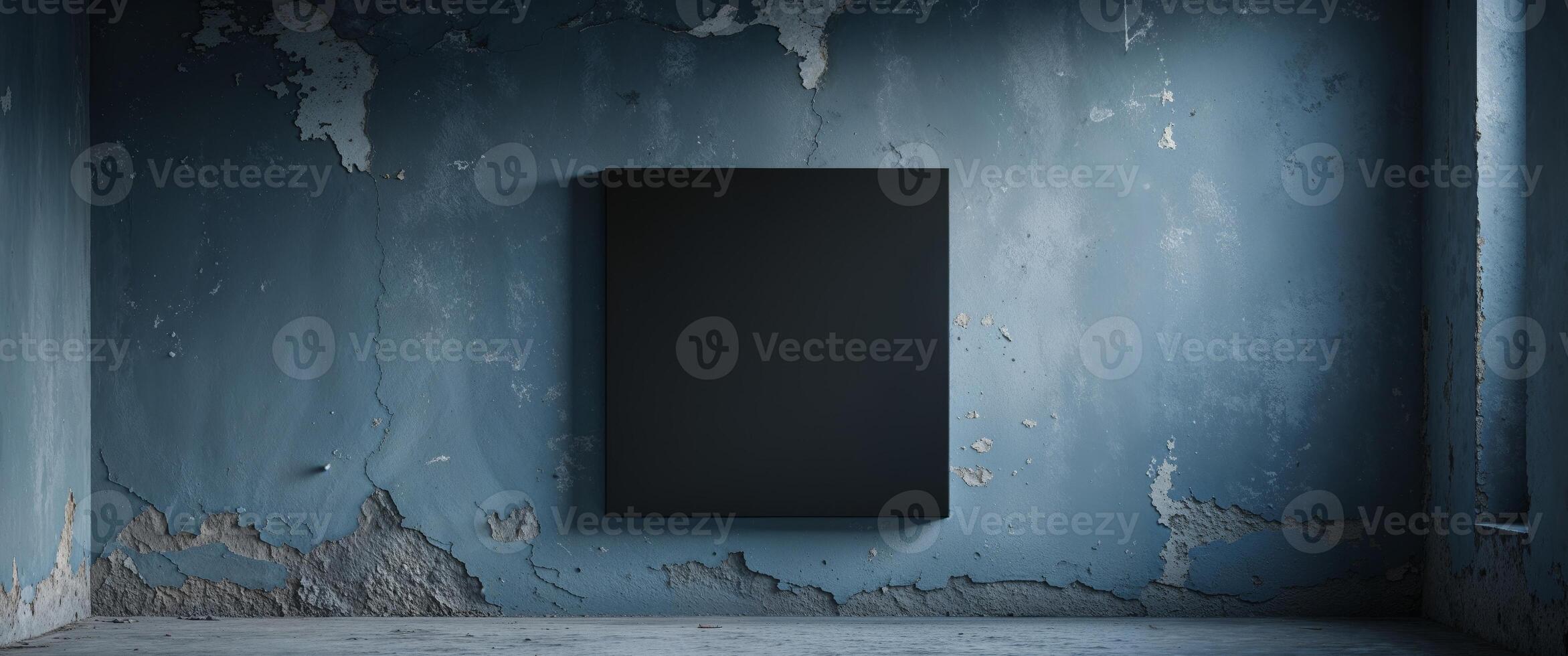A black square on a wall in an empty room photo