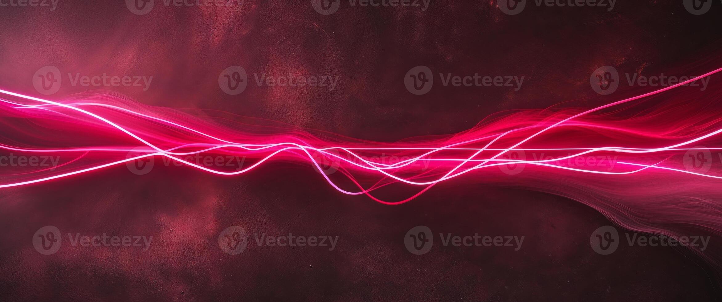A pink light wave is shown in the dark photo