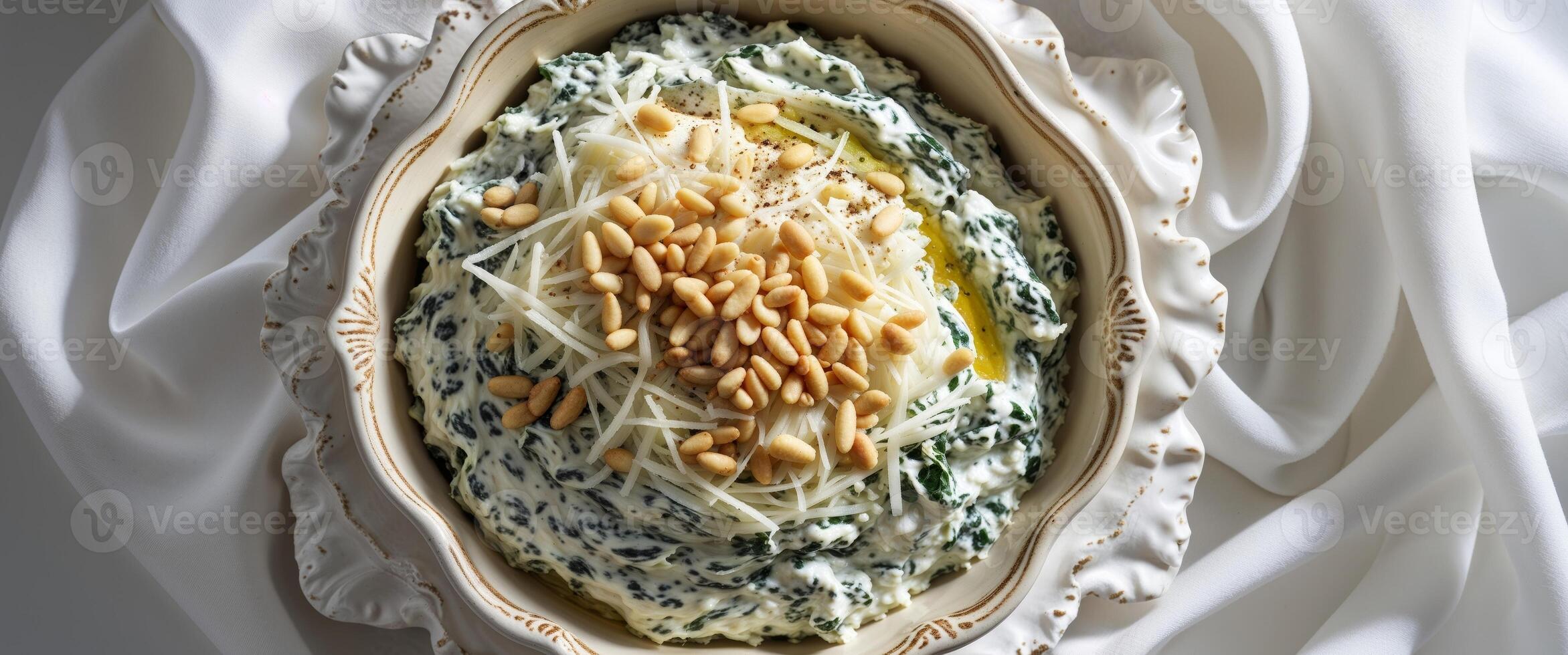Spinach and ricotta cheese dip with pine nuts photo