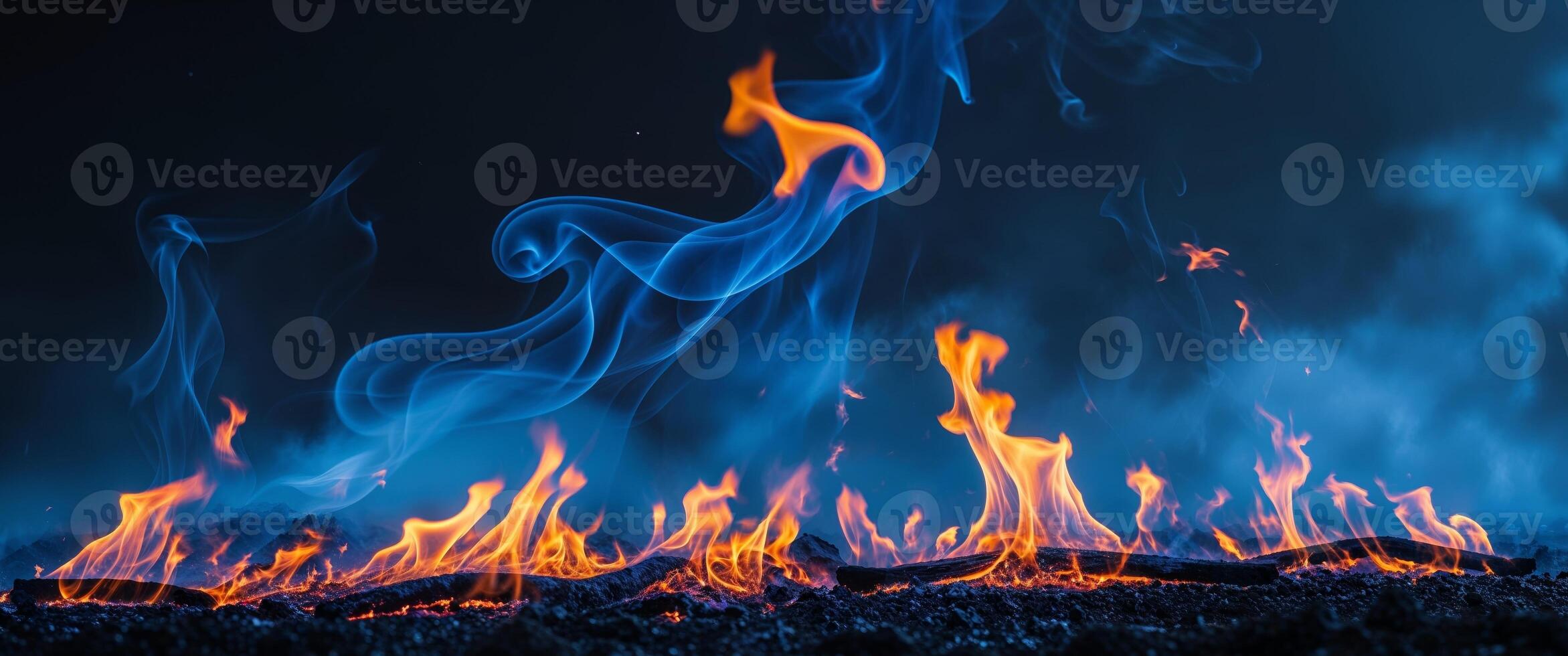 Blue fire flames on a black background photo