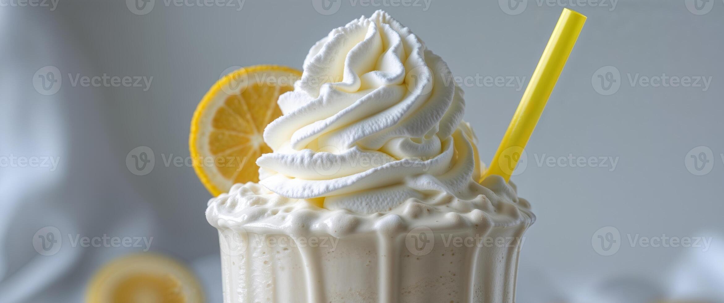 Creamy Vanilla Milkshake with Whipped Cream and Yellow Straw. photo