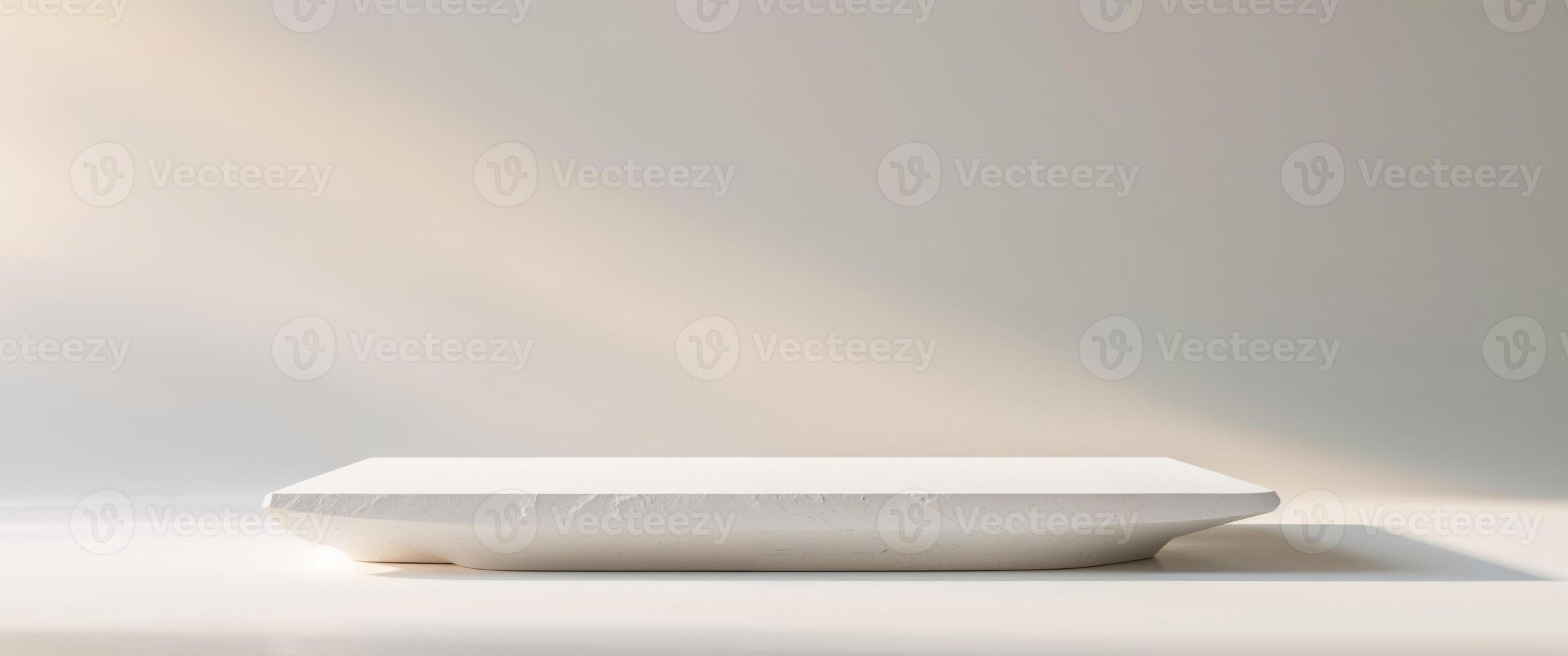Clean white stone slab with a matte finish and gentle light reflections. photo