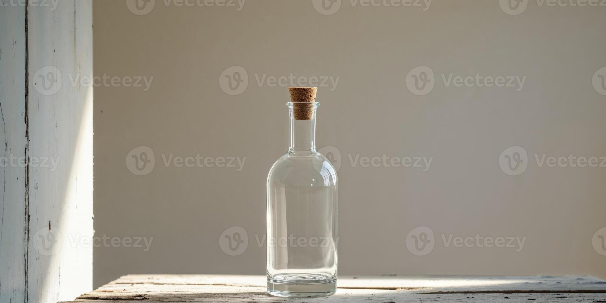 Clear Empty Glass Bottle with Cork Stopper on Rustic Wooden Table photo