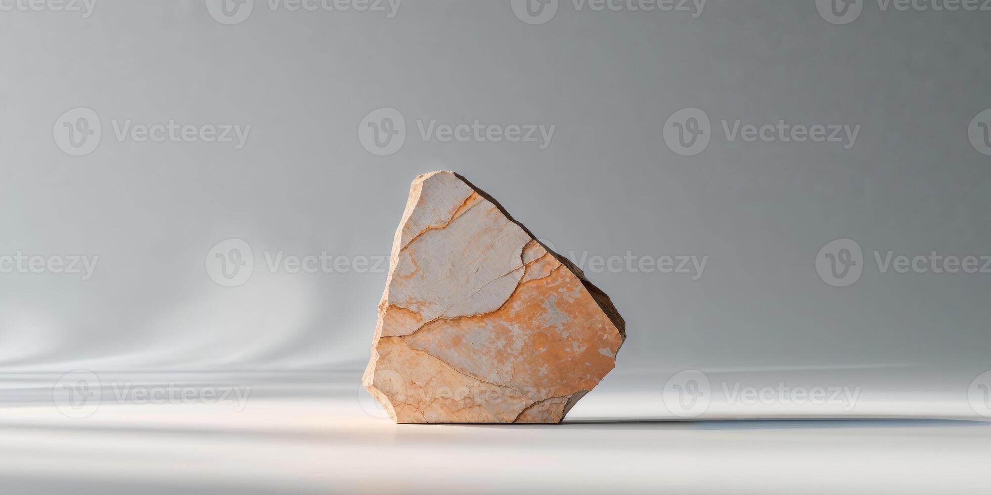 Pale Orange Stone Sample on Gray Background. photo