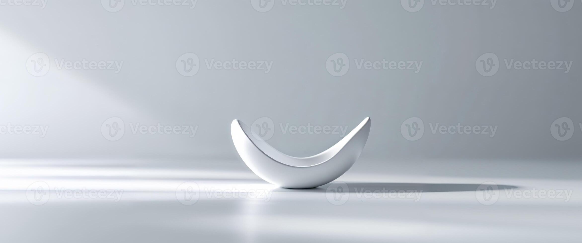 A white vase with a curved shape on a white surface photo