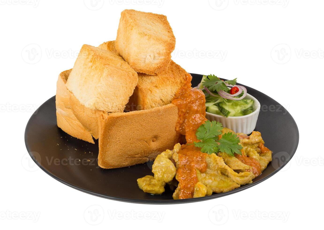 Pork satays with peanut sauce and pickles which are cucumber slices and onions in vinegar served with toast isolated on a white background. photo