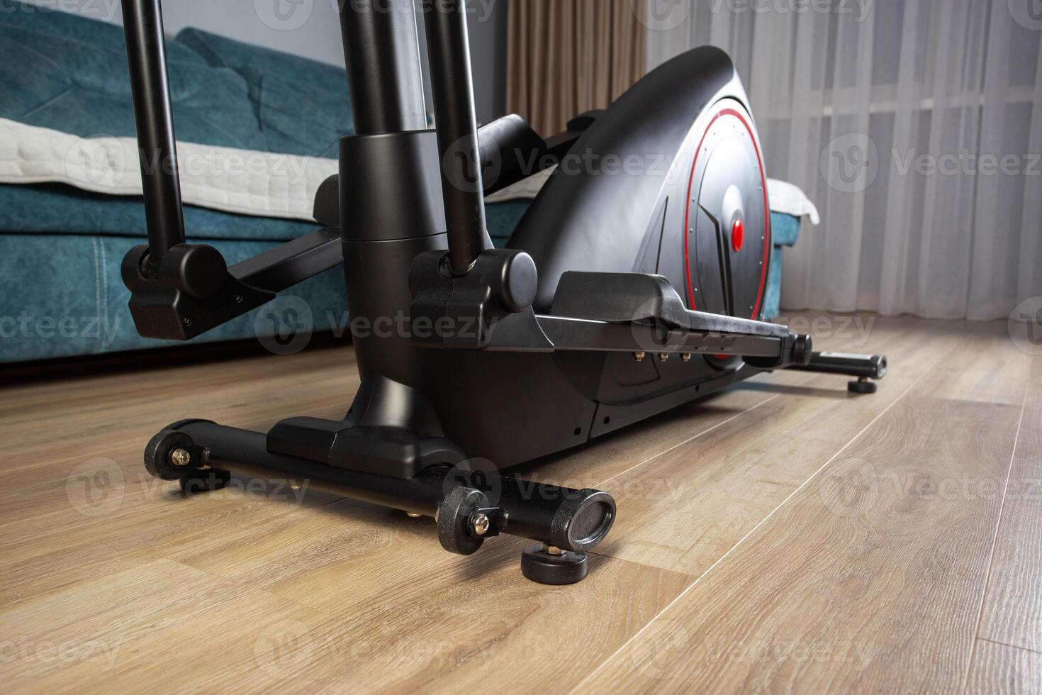 Modern Elliptical Trainer in the Room at Home. Concept of Exercising at Home, fitness photo