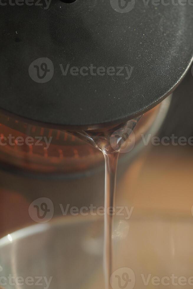 Brewing aromatic herbal tea in a glass kettle photo