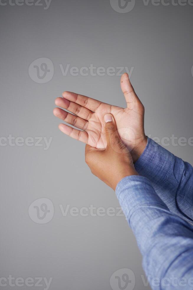 young man suffering wrist pain photo