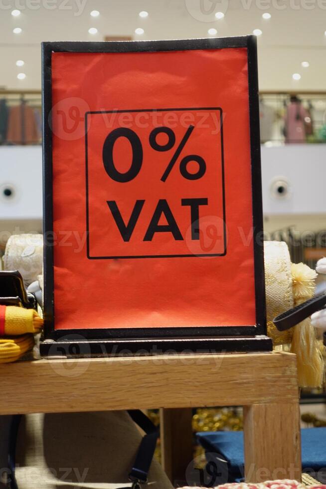 Sign promoting 0 percent VAT on products in a retail store photo
