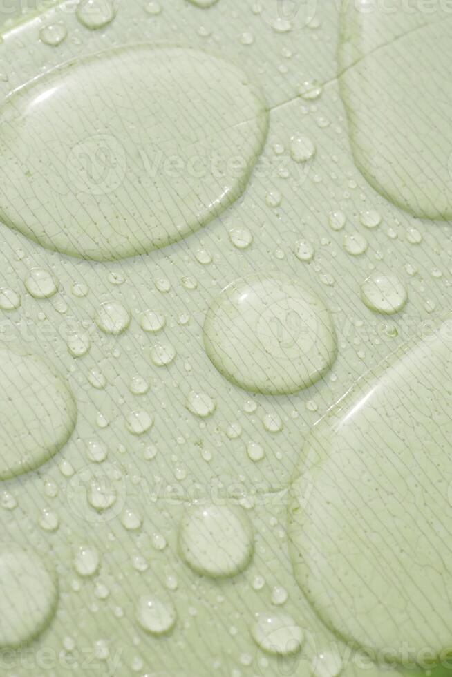 Water droplets on a smooth surface after a gentle rain shower photo