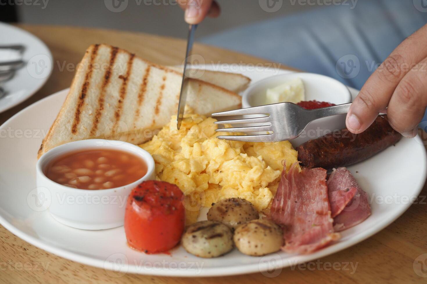 Delicious breakfast served with scrambled eggs and toast photo