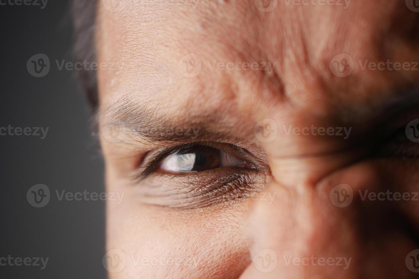 Expressions of intensity captured in a close-up portrait of a man photo