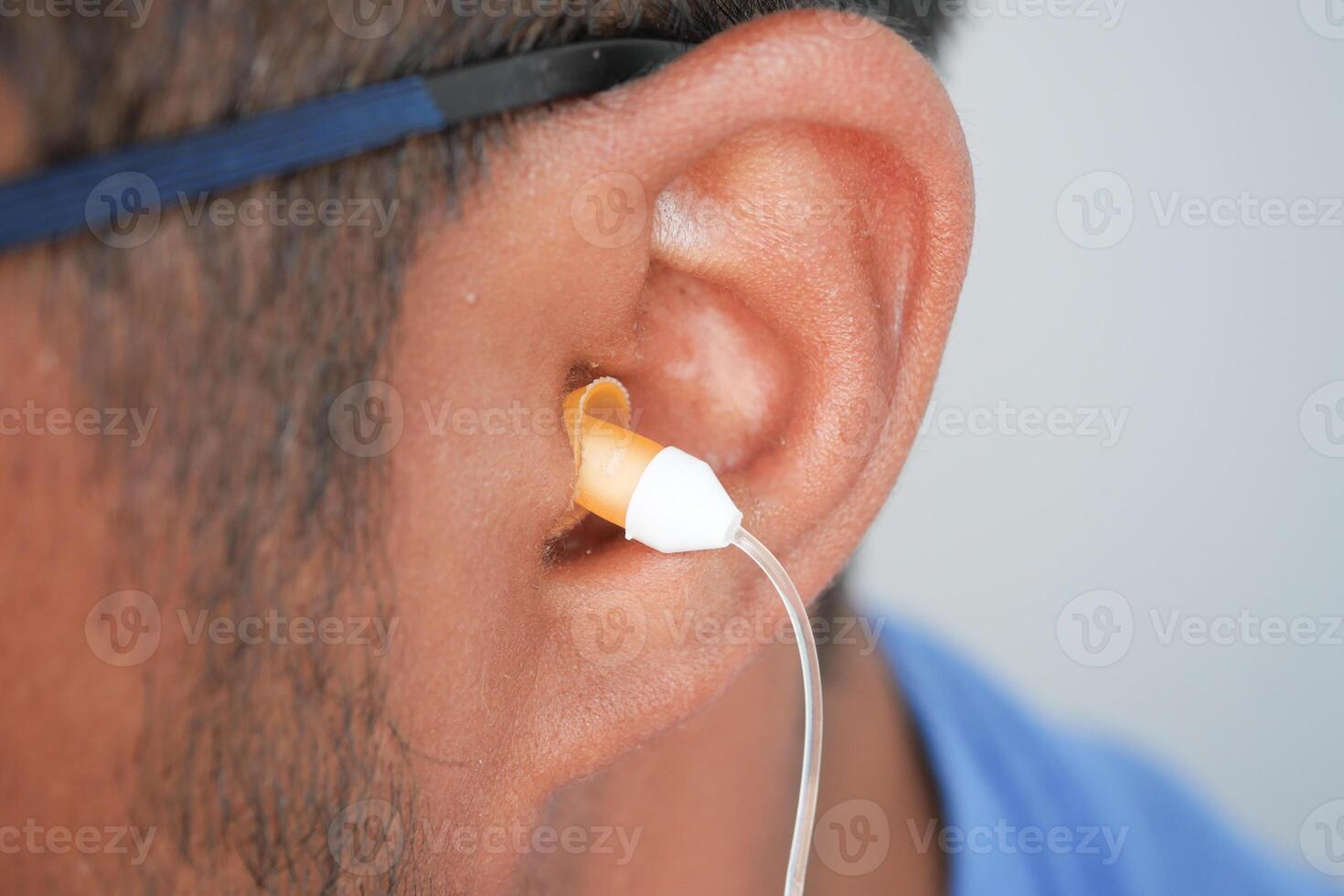 Ear protection being fitted by a person during a quiet event photo