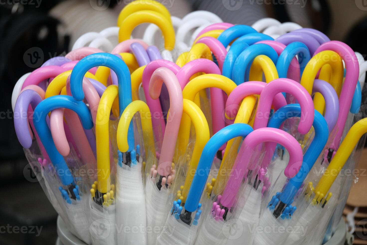 Colorful umbrellas arranged in a striking display for sale photo