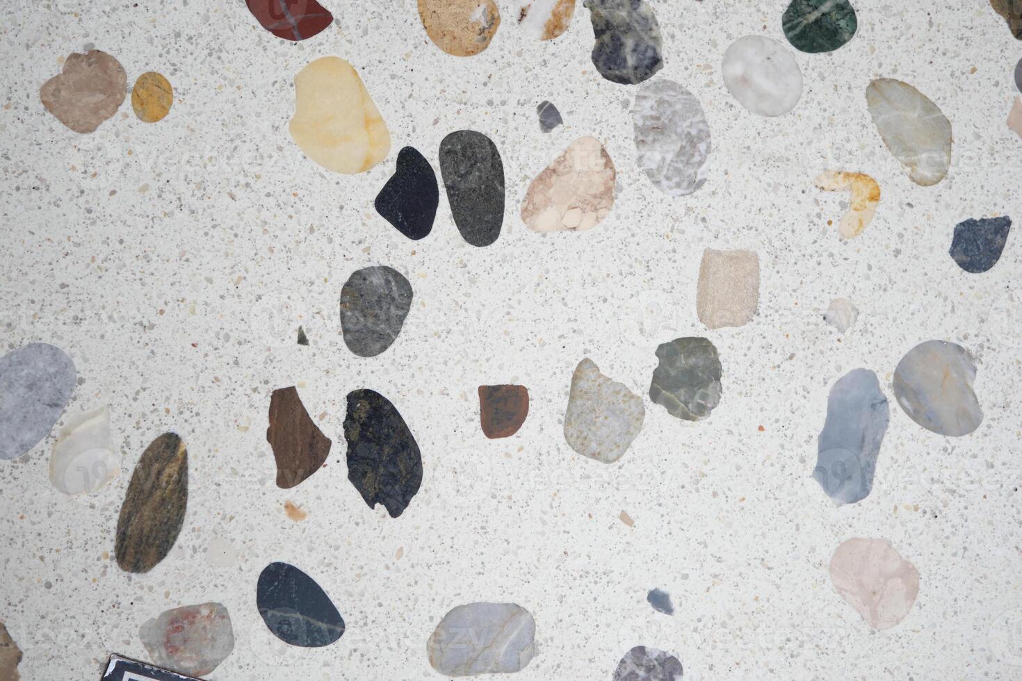 Colorful gravel surface in a polished stone floor photo