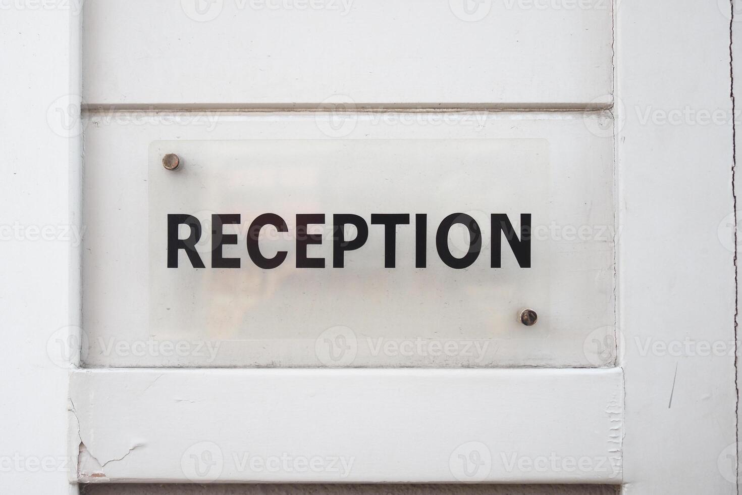 Reception sign displayed on a wall near the entrance area photo