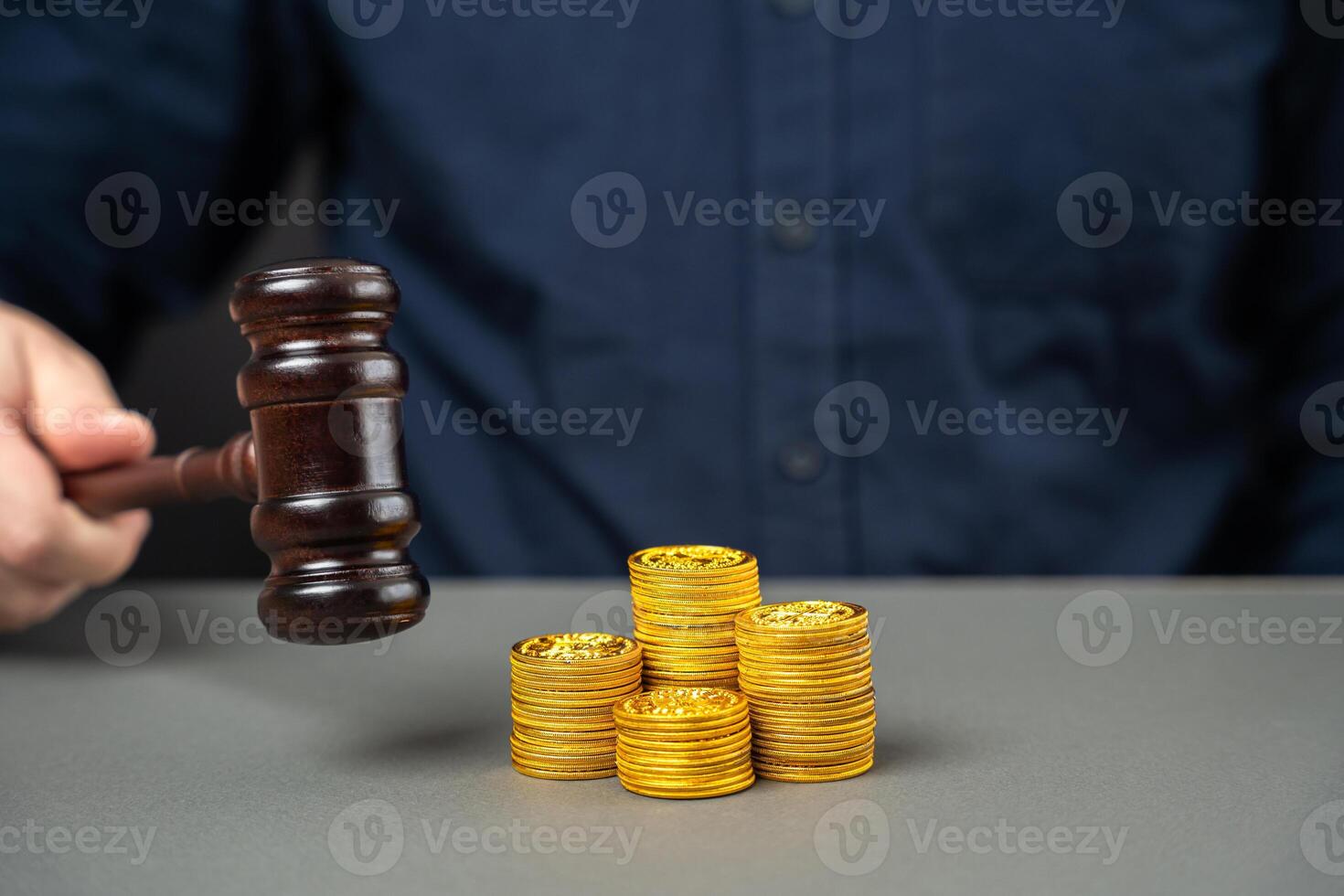 Judge's gavel and stack of coins. Litigation, dispute resolution, conflict of interest settlement. Awarding moral financial compensation. Justice, rule of law. Lawyer services. Protection of rights photo