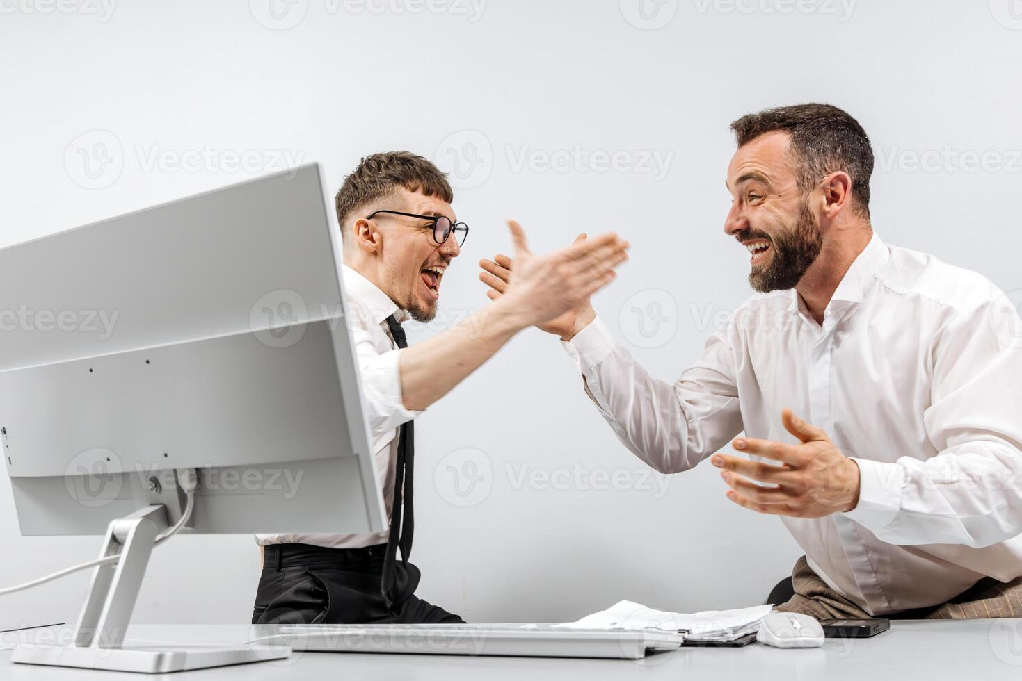 Two happy successful excited businessmen celebrating a successful stock trade, the rise of cryptocurrencies in the crypto stock market. The concept of winning and profits photo