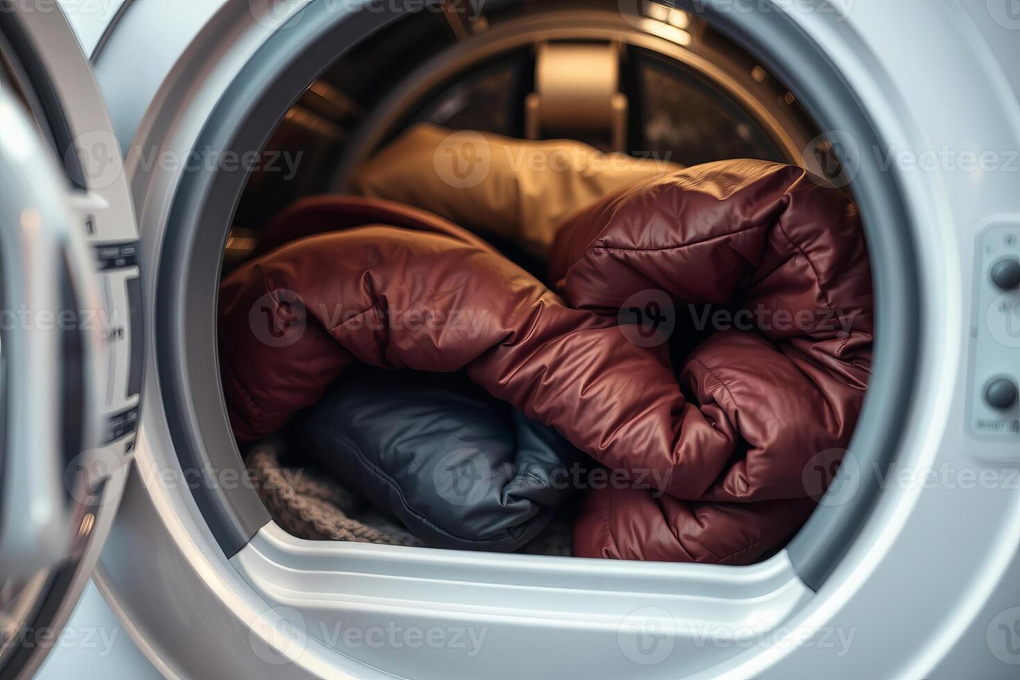 Winter jackets in front-loading washing machine before wash photo