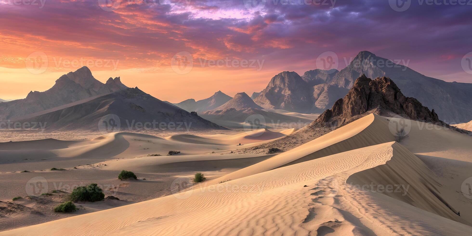 A vast desert landscape with rolling sand dunes, towering mountains in the distance, and a vibrant sunset sky with pink and orange hues photo