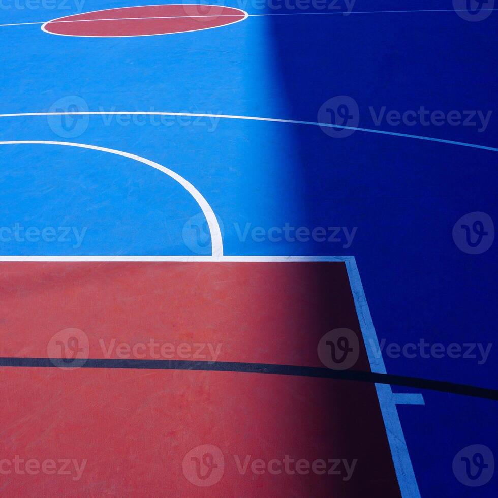 blue and red street basketball court on the street, abandoned photo
