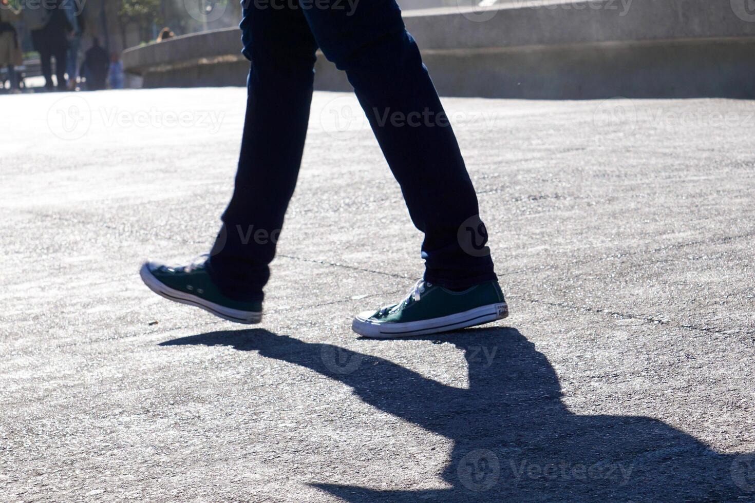 people's legs walking around photo