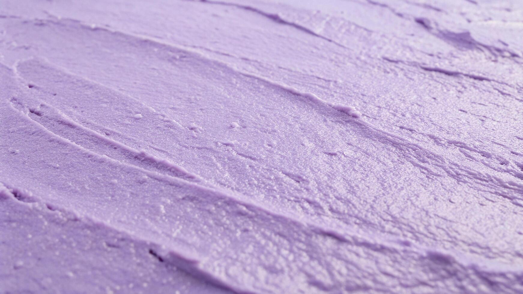 a close up of a purple frosting on a cake photo