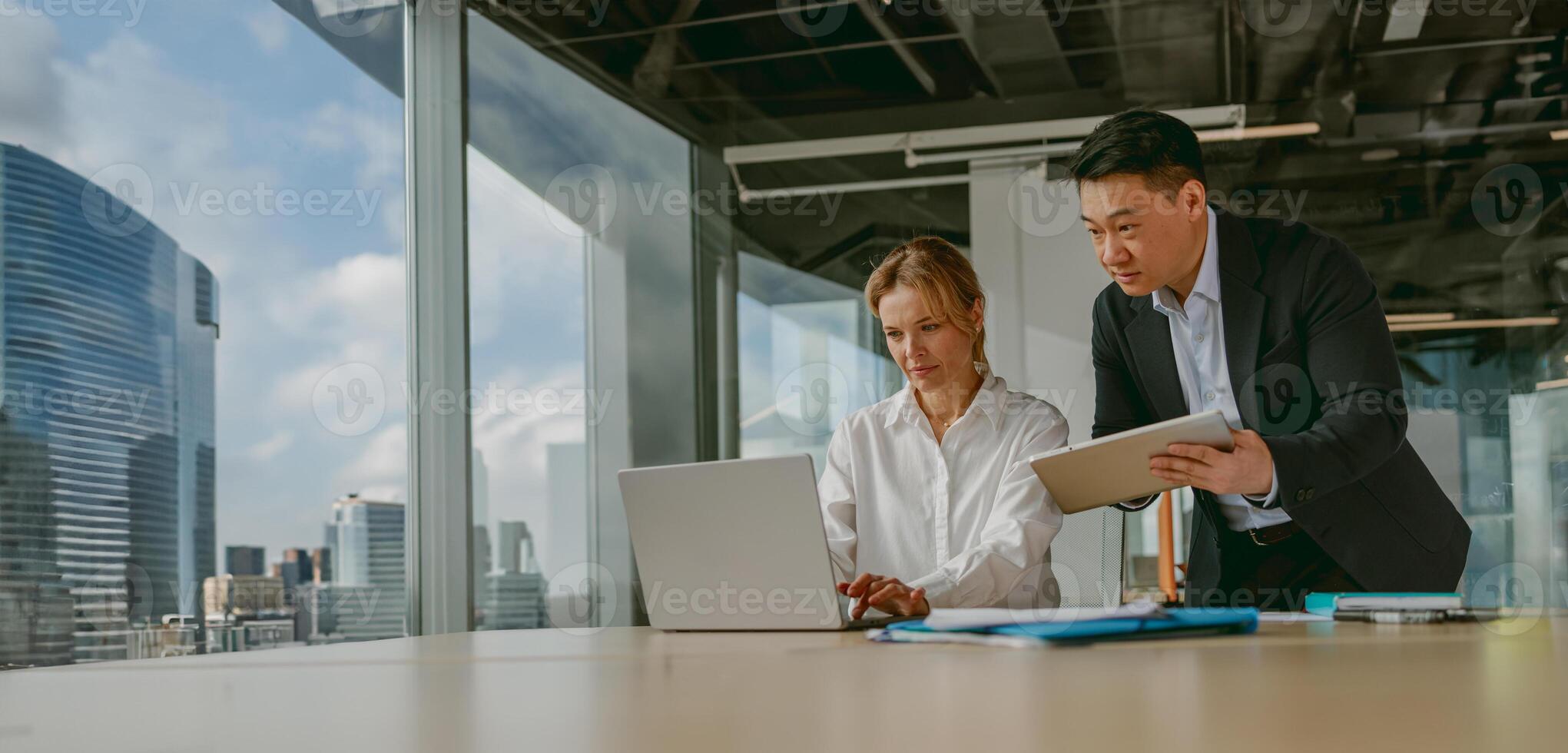 Engaging in a Collaborative Business Meeting within a Modern Office Environment Setting photo