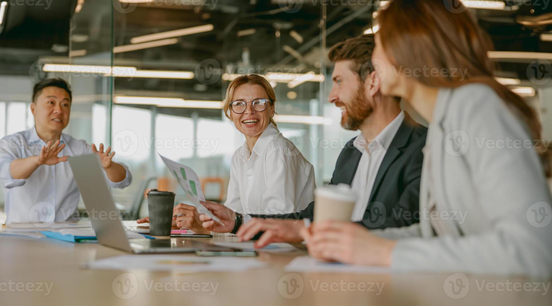 Dynamic Team Meeting Taking Place in a Stylish and Modern Office Setting for Collaboration photo