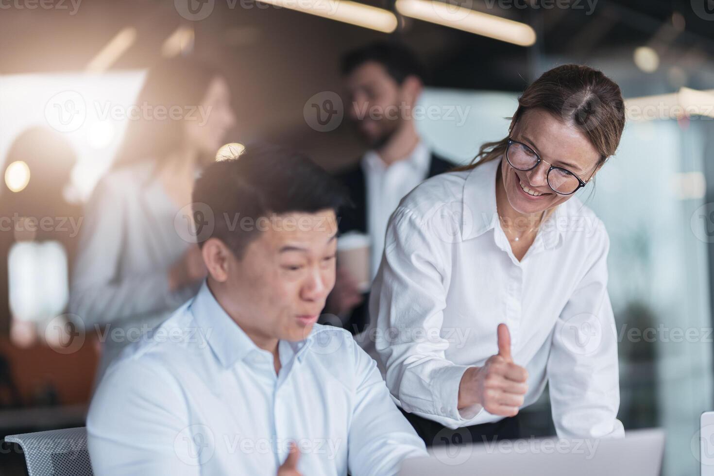Smiling female employee discussing online project, showing presentation to skilled team leader photo