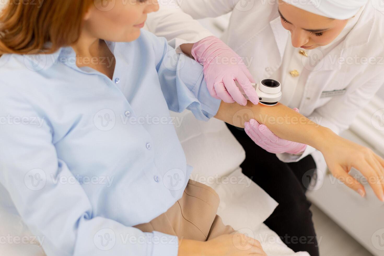 A woman getting an injection from a doctor photo