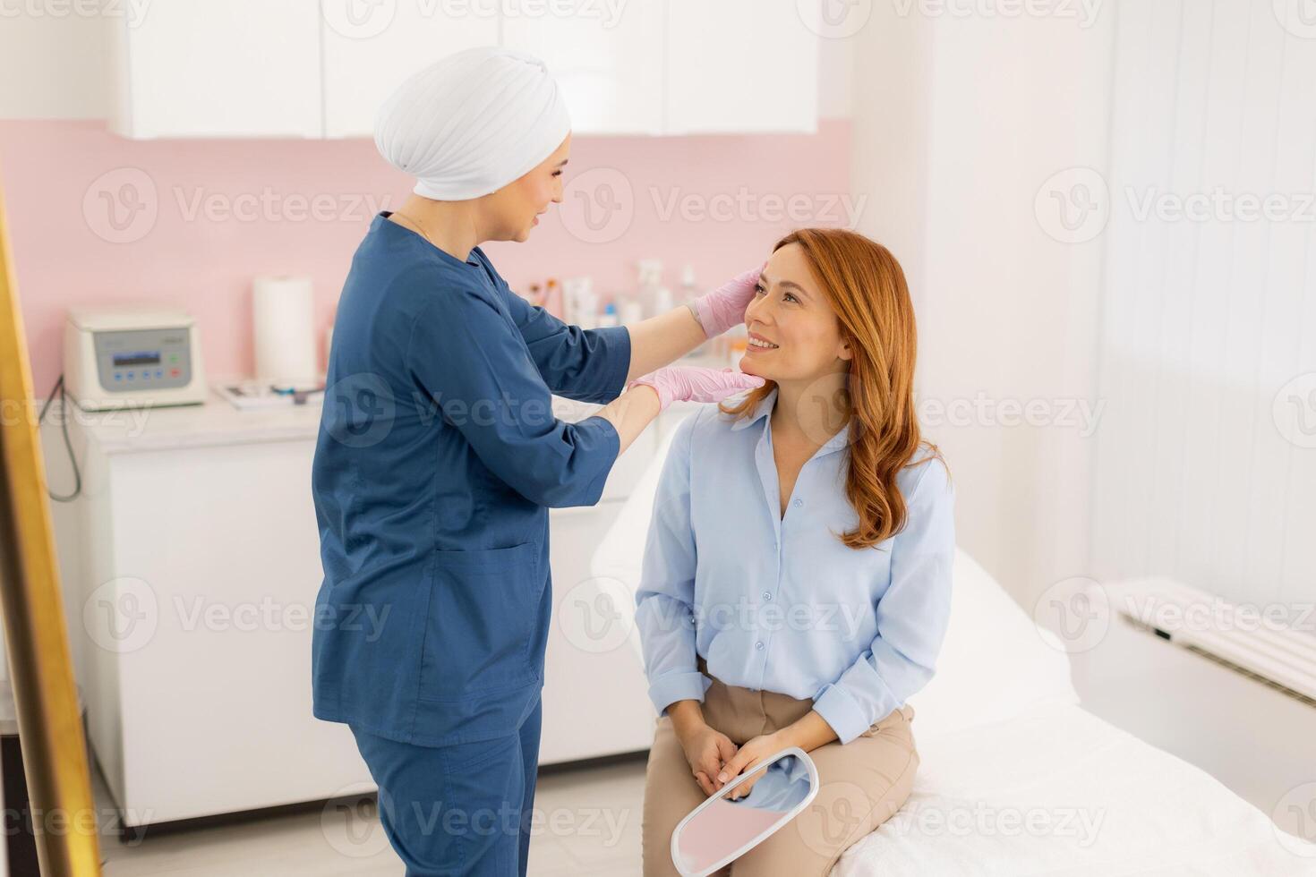 A woman getting her hair done by a doctor photo