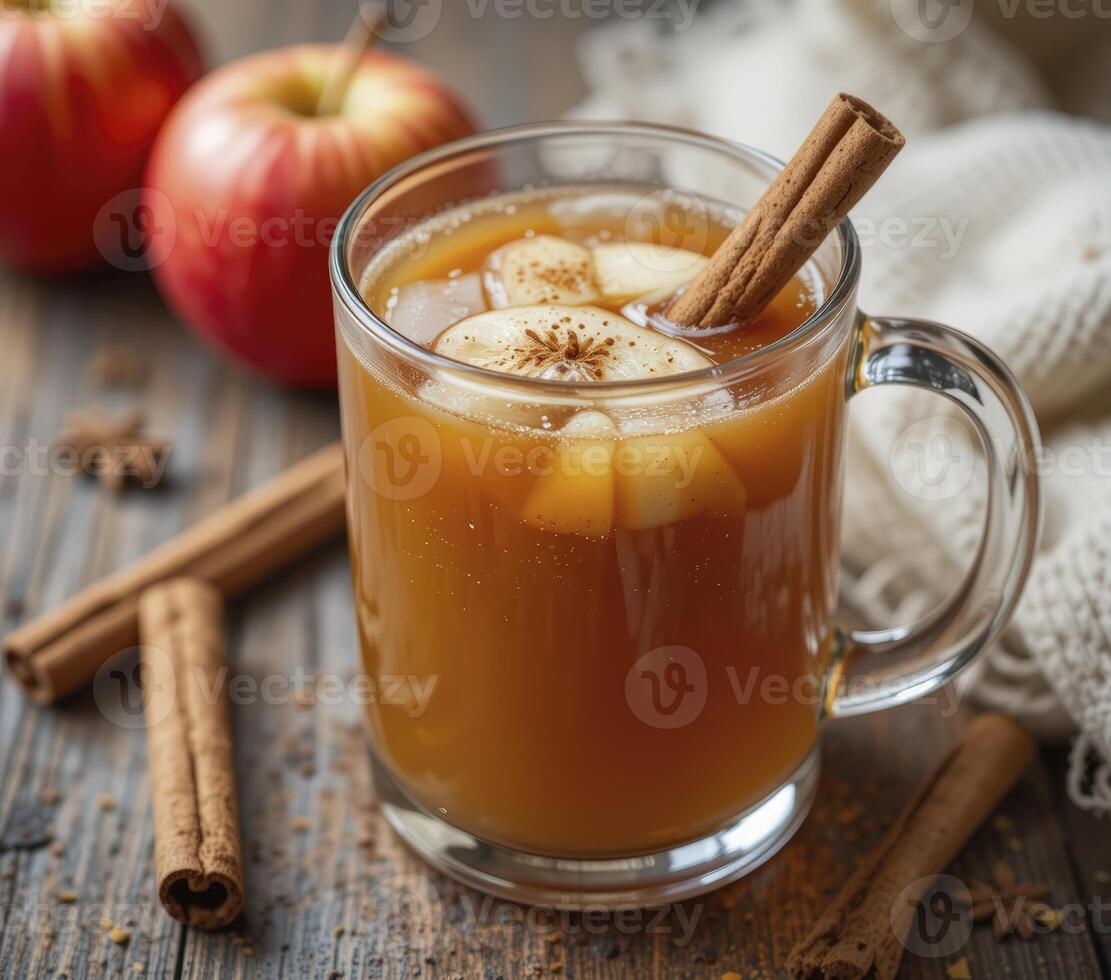 Warm Apple Cider with Cinnamon Sticks and Apples on Rustic Wooden photo