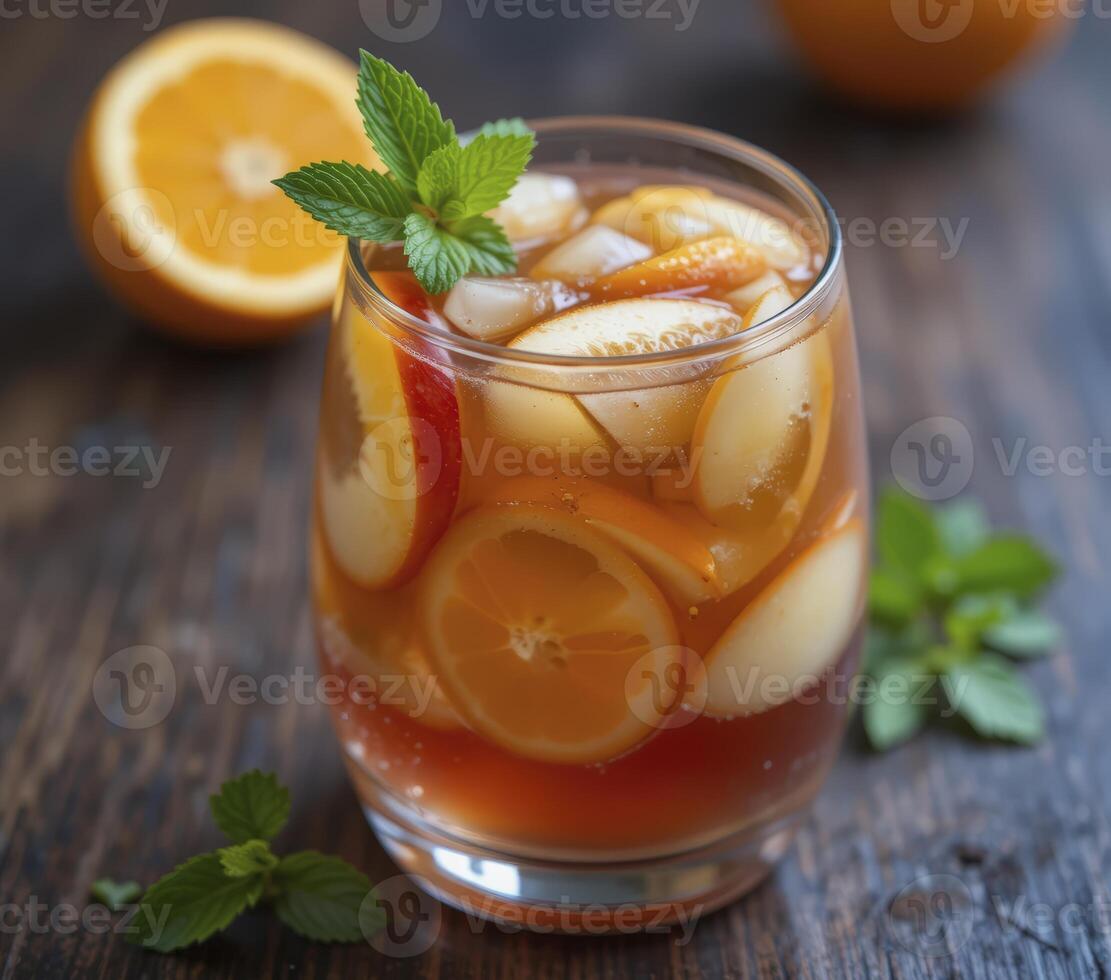 Iced Tea with Citrus and Apple Slices and Mint photo