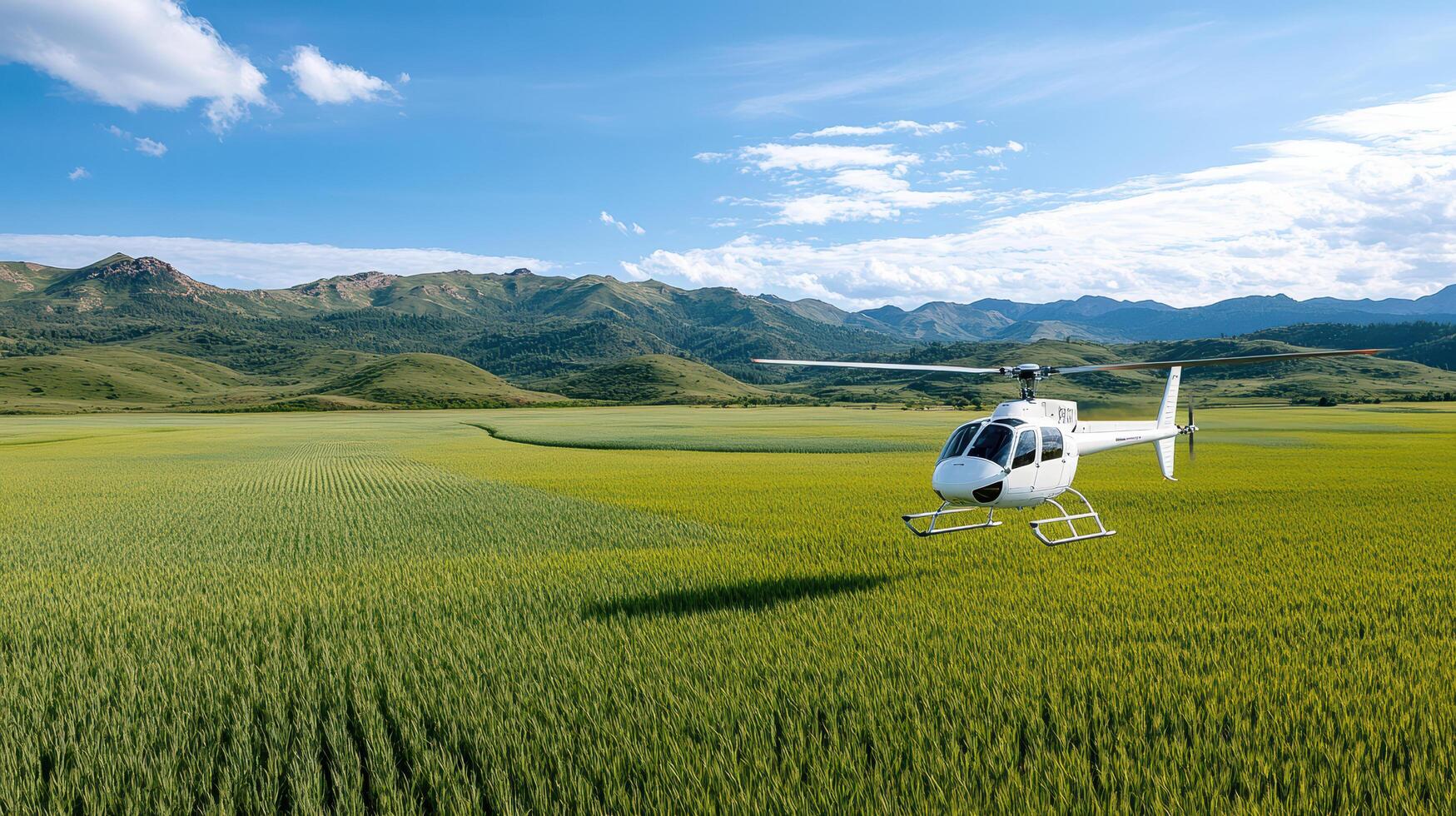 A helicopter flying over a green field with mountains in the background photo