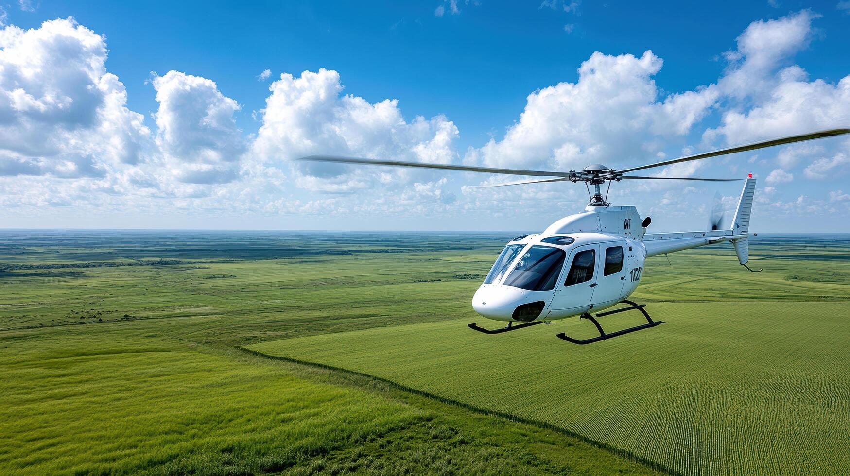 Helicopter flying over a green field photo