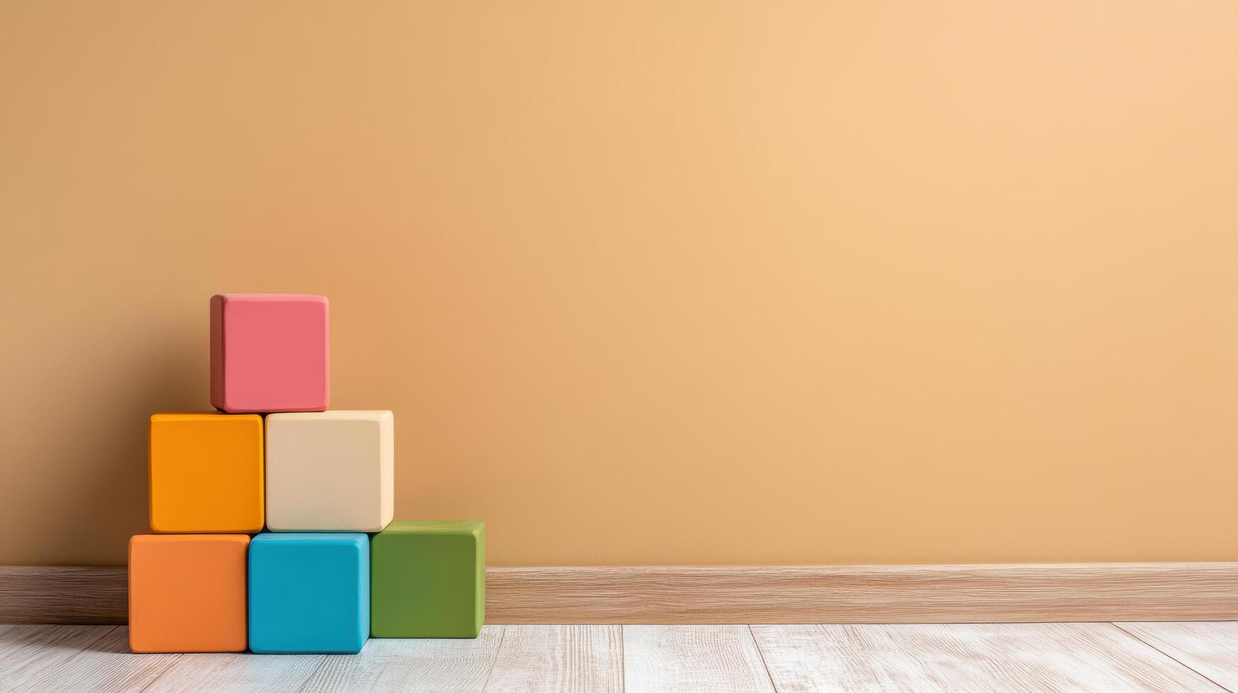 Colorful blocks on the floor in front of an orange wall photo