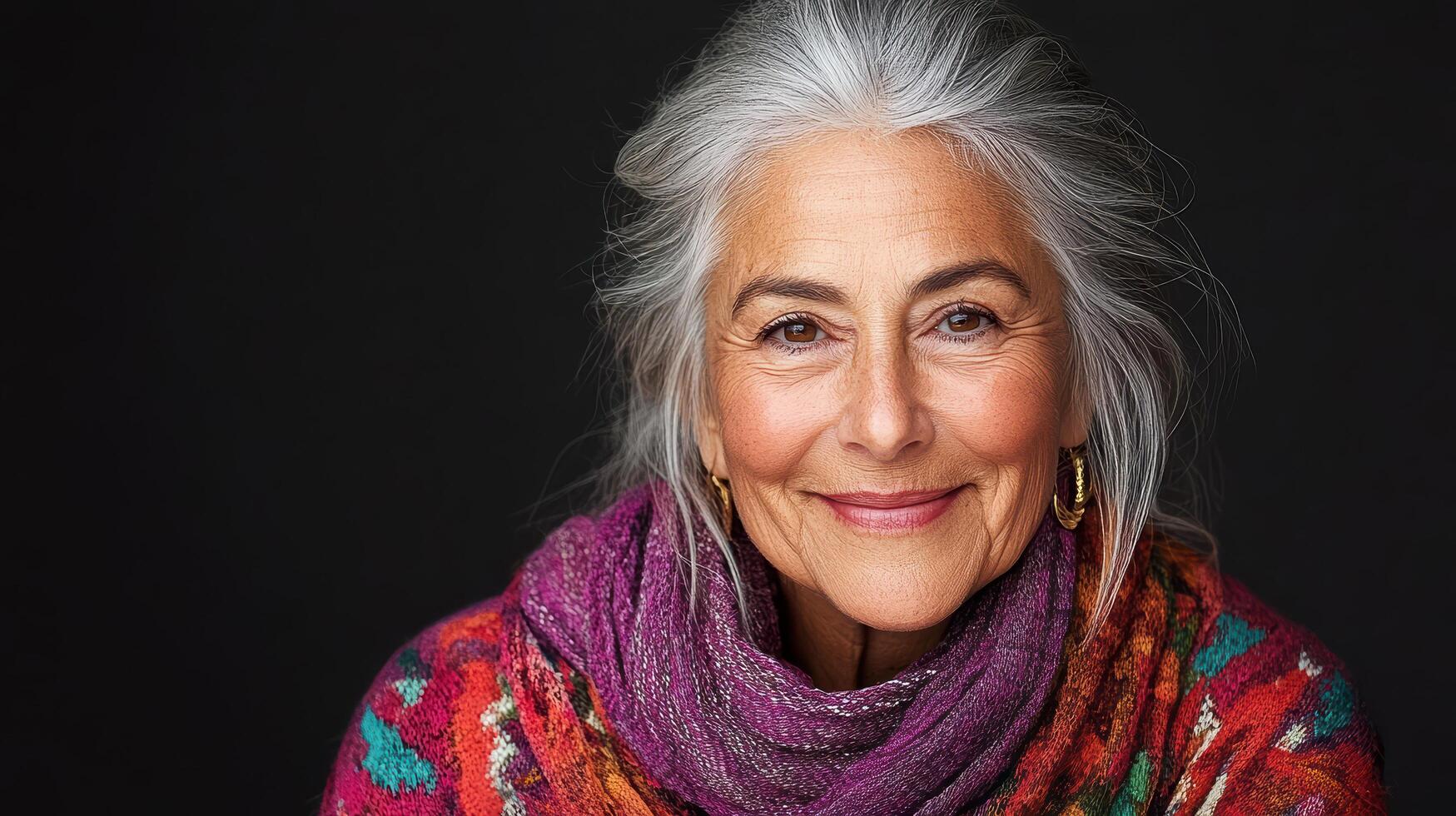 An older woman with gray hair and a scarf photo